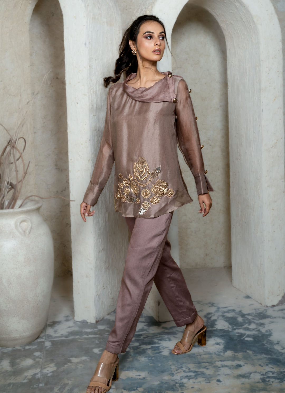 Woman in a champagne brown outfit with zardozi embroidery 