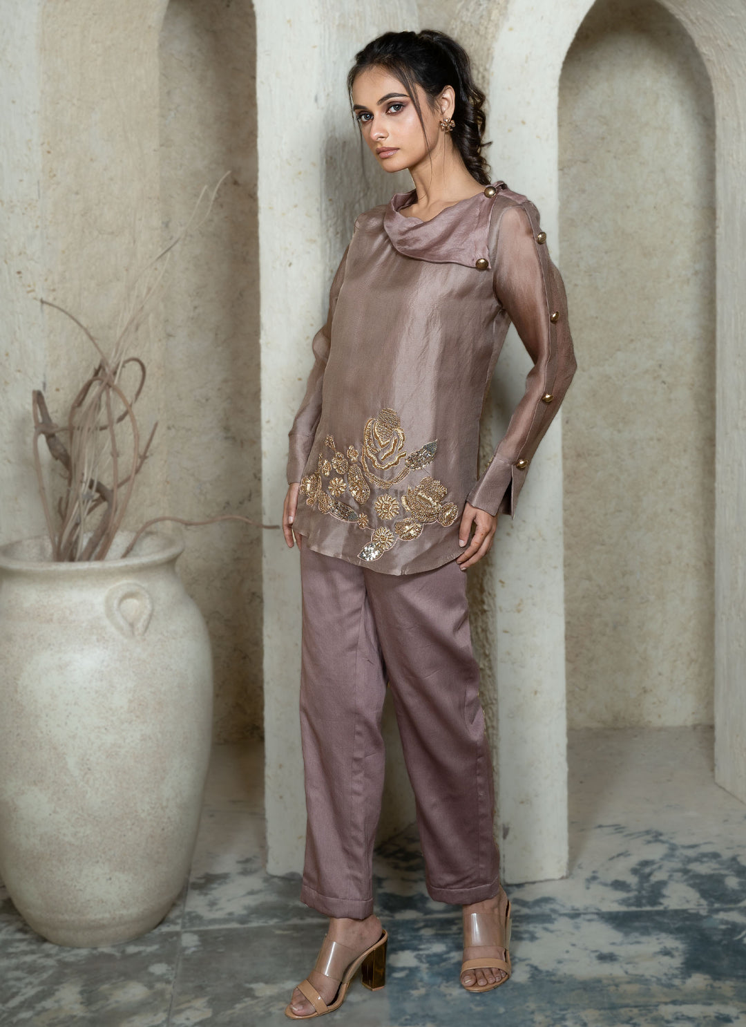Woman in a champagne brown co-ord set with gold zardozi embroidery 